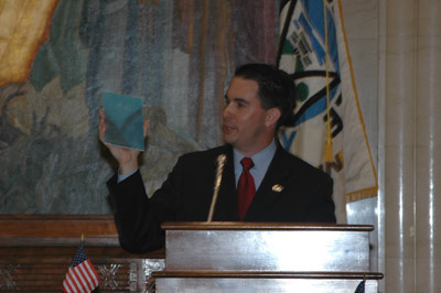 County Executive Walker holds a piece of the Annex