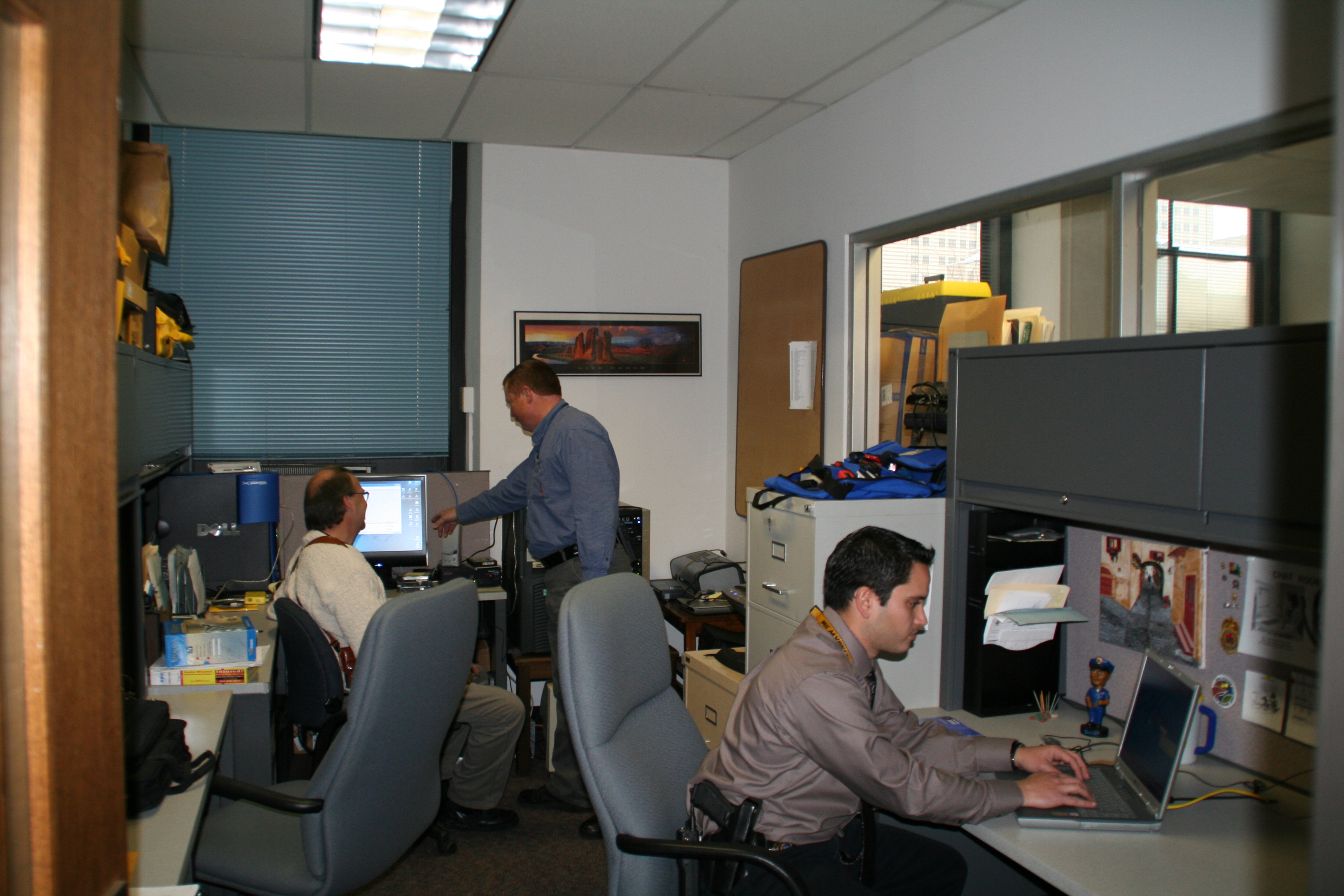 Detectives working on an investigation in the Computer Crimes Unit