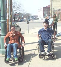 Picture of two people in wheelchairs