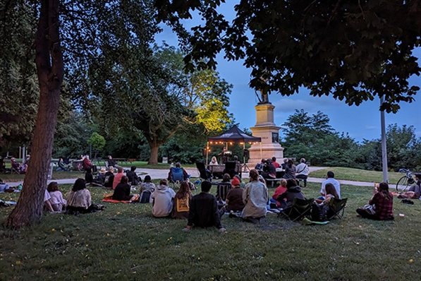 Poetry in the Park - people gather in Juneau Park to listen to a poetry reading
