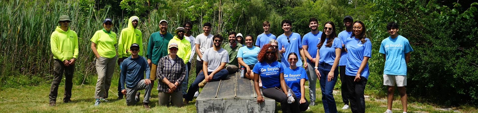 smiling group of volunteers in a park