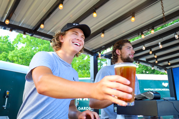 Employees serving at beer garden