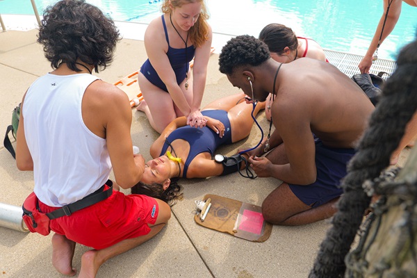 training lifeguards practice CPR