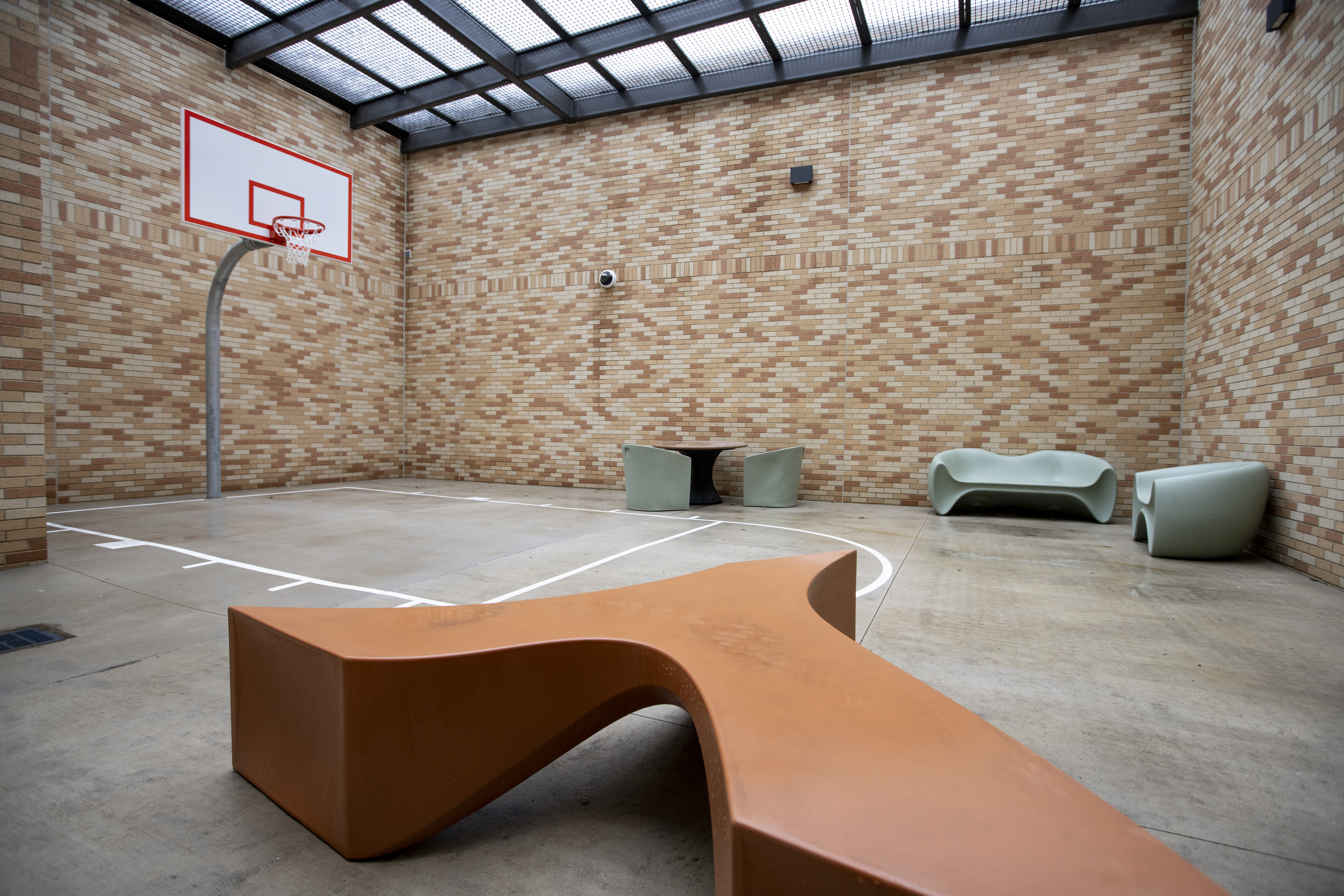 Outdoor recreation area with basketball court