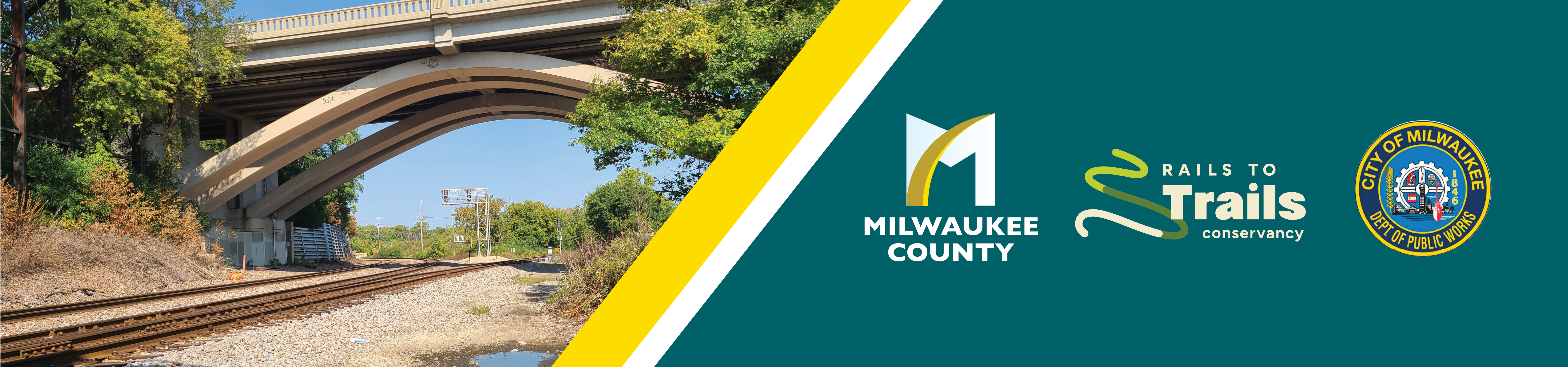 bridge over 30th street corridor, including logos from milwaukee county, the rails to trails conservancy, and the city of milwaukee department of public works
